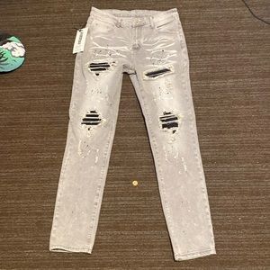 Gray skinny jeans with pain splatter
